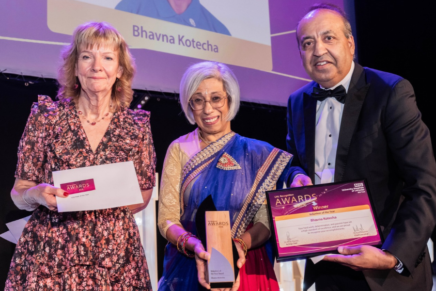 Bhavna Kotecha, UHL's Volunteer of the Year 2026, receives her award from Non-Executive Director, Jill Houghton (left) and Councillor Zuffar Haq (right)
