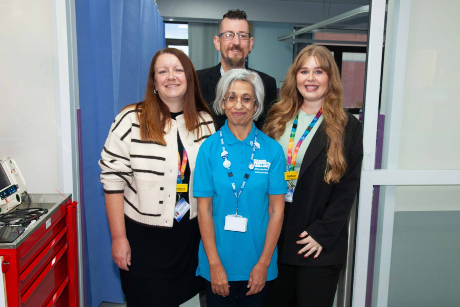 Bhavna Kotecha at the front of a group of colleagues at the Leicester Royal Infirmary, with (from left to right): VALE Coordinator, Vanessa Adcock; Craig McGorum, Senior Philanthropy Assistant at Leicester Hospitals Charity; Bethan Proudman, UHL's Volunteer Services Manager