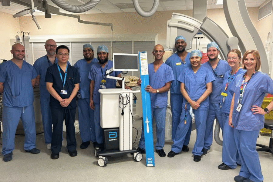 Consultant Cardiologist, Riyaz Somani, holds the Abbott Volt PFA system, surrounded by colleagues at the Glenfield Hospital