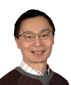 Gang Xu, man smiling with a white background