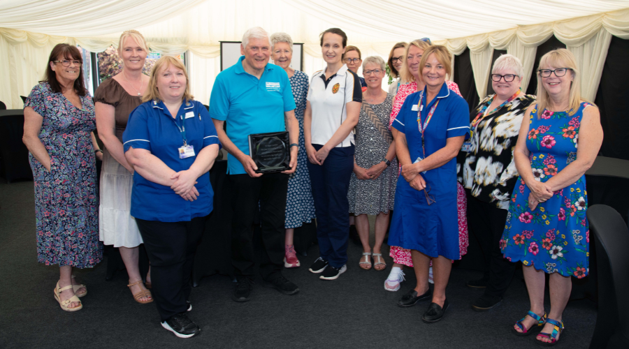 Volunteer Roger Latham with colleagues from the UHL cardiac rehabilitation service, at a special event to celebrate his 20 years of volunteering.