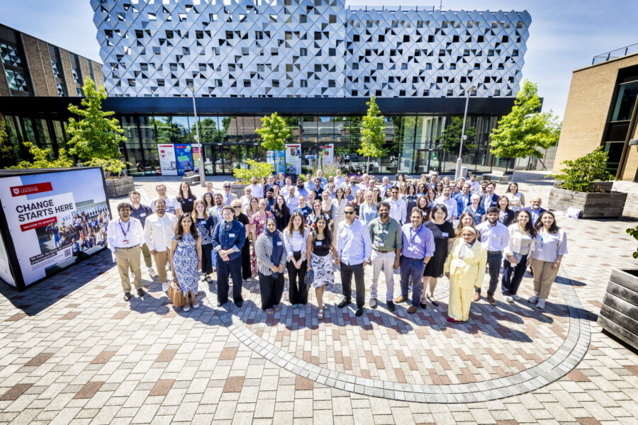 Delegates, who had travelled from across the UK and internationally, stood outside the university