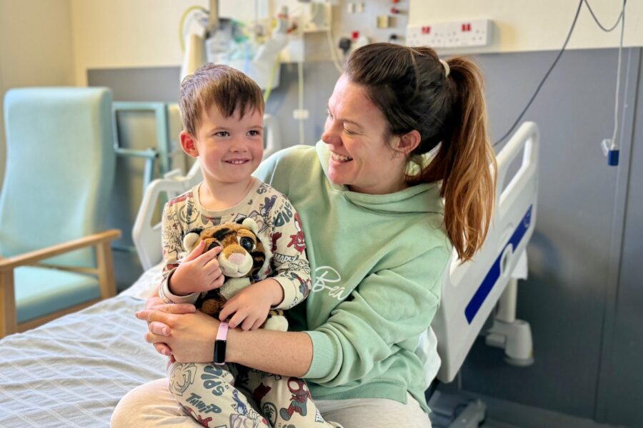 Jade Harvey, and son Reuben, at the hospital bed smiling