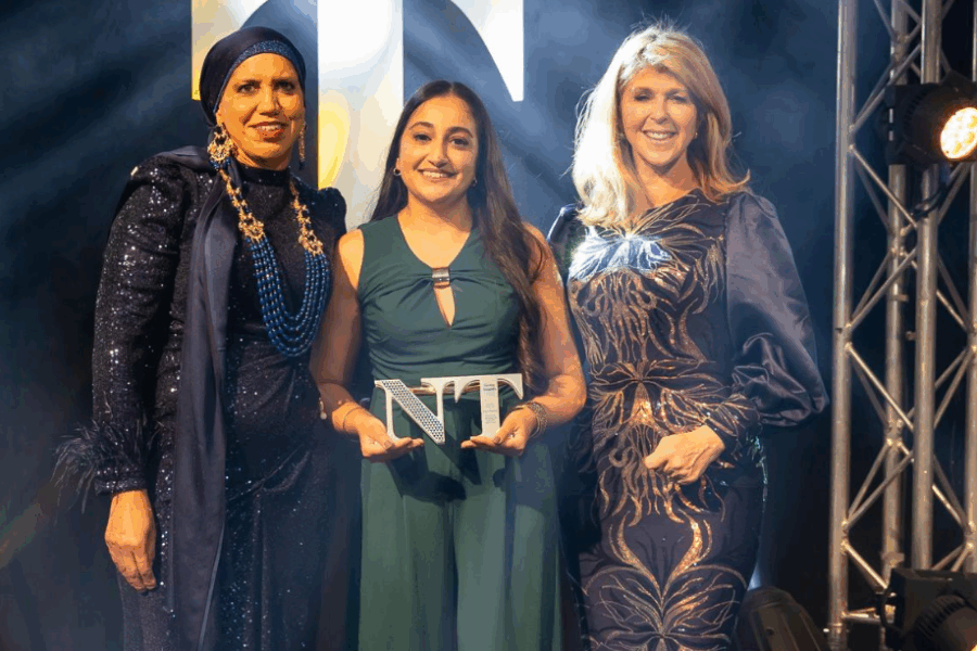 Dalvir Kandola, Consultant Midwife, is presented with her Midwife of the Year award by former winner Waheeda Abbas and broadcaster Kate Garraway.